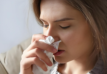 Why do my ears make popping noises when I irrigate my nasal cavity